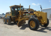 A Yellow Color Truck With a Soil Digging Tool