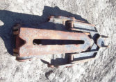 A Rusted Mechanical Thumb on Ground Back