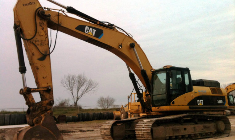 An Excavator With Claw Resting on the Ground