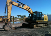 An Excavator on a Black Dirty Ground