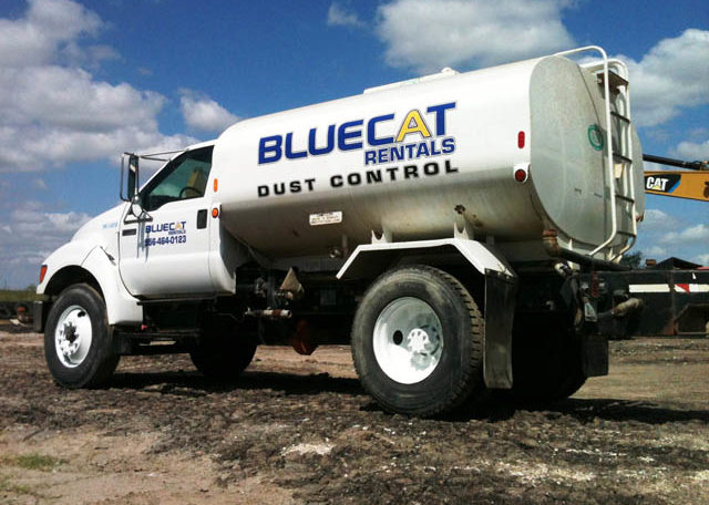 A Blue Cat Water Truck Back Side View