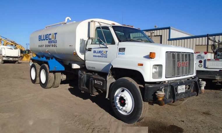 A GMC Heavy Duty Water Truck in White