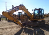 A Yellow Color Cat Excavator on Land