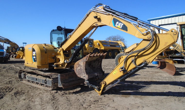 A Cat Yellow Color Bulldozer With Claw