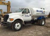 A White Color Blue Cat Water Truck Side View Shot