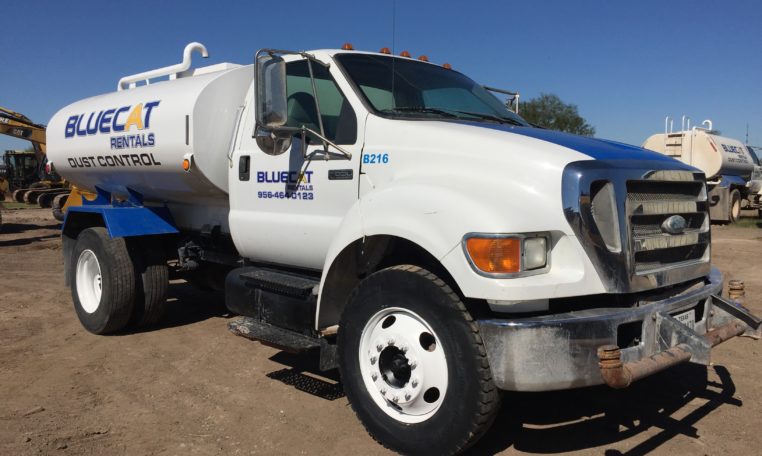A White Color Blue Cat Water Truck in Parking