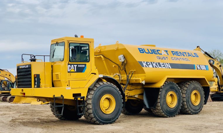 A Blue Cat Water Truck Front Side
