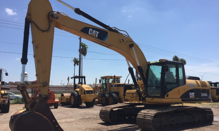 A Cat Excavator With Branding on Claw Arm