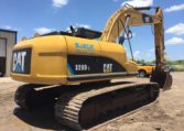 A Cat Excavator With Claw Attached Back