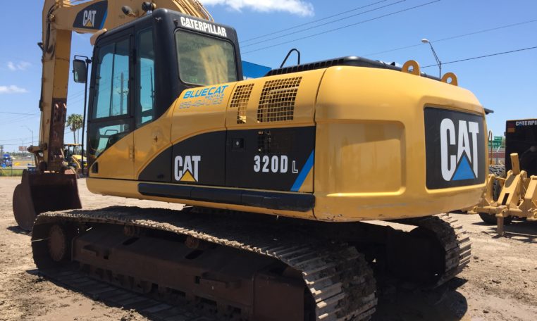 A Cat Excavator With Claw Attached Back Rotated
