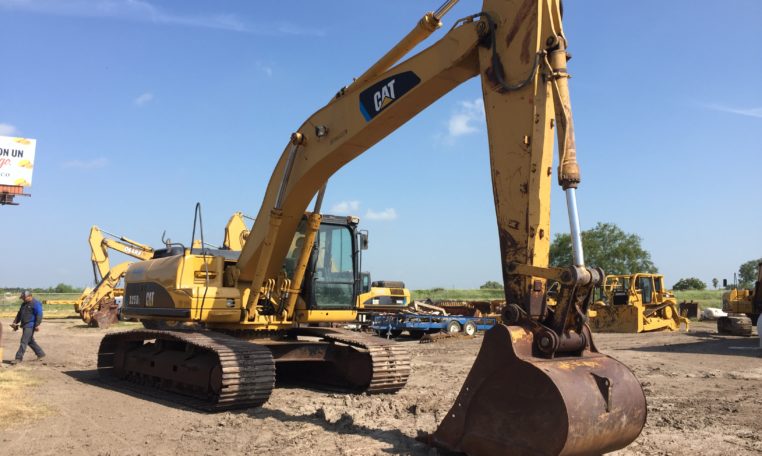 An Excavator With the Claw on the Ground