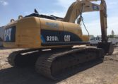 An Excavator With the Claw on the Ground Back