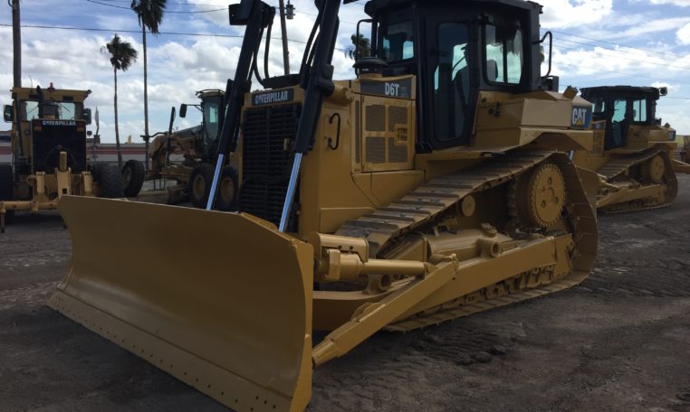 A Yellow Color Bulldozer With Clean Claw